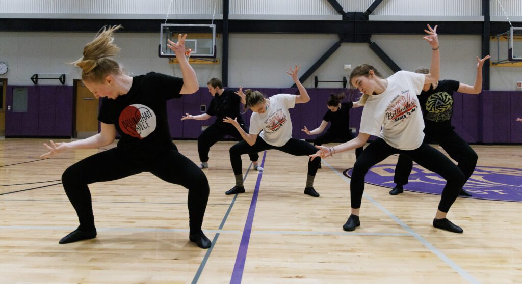 The Bellingham High School dance team practices a military piece called “Black Widow” in the gym.