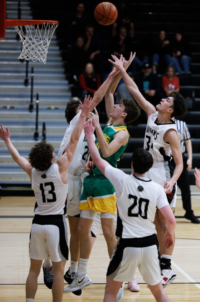 Lynden’s Cameron Petersen while under pressure from multiple Bellingham defenders, makes a shot.