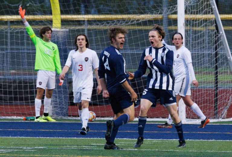 Squalicum's Joshua Durfee (14) cheers after a score.