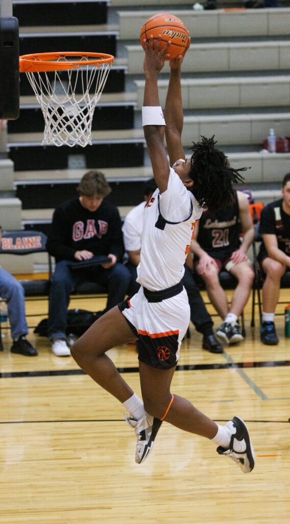 Blaine’s Mathew Russ puts up a slam dunk.