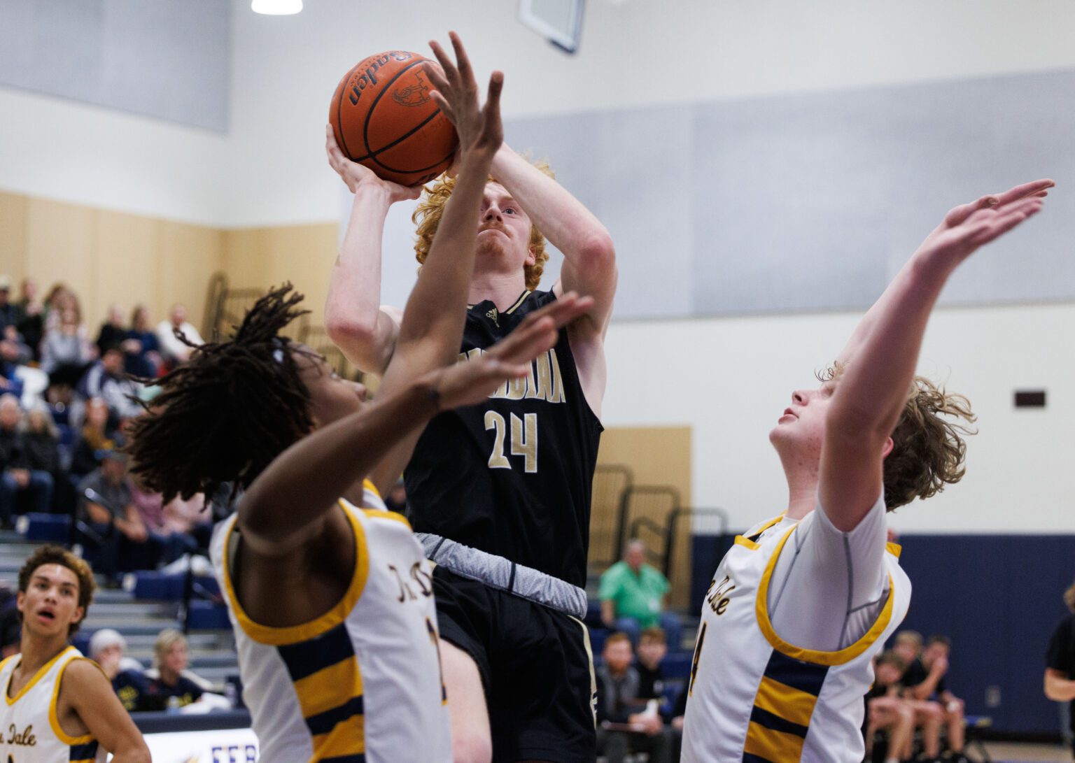 Meridian's Hunter Jones puts up a shot over Ferndale defenders.