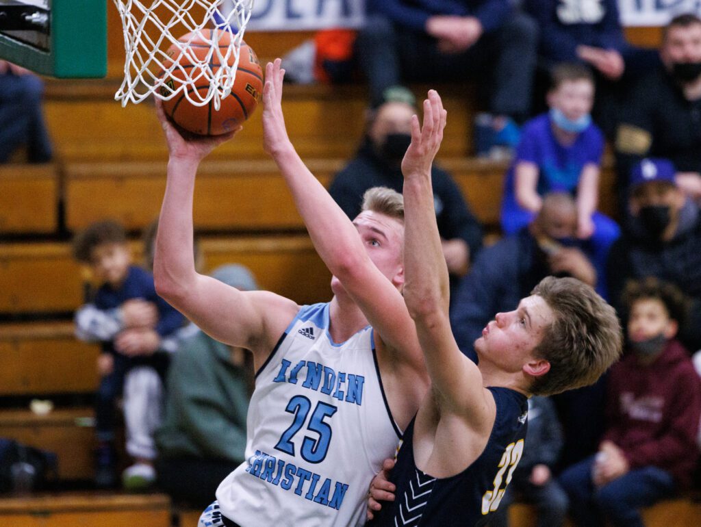 Lynden Christian's Jeremiah Wright keeps an eye on the basket as he puts up the ball.