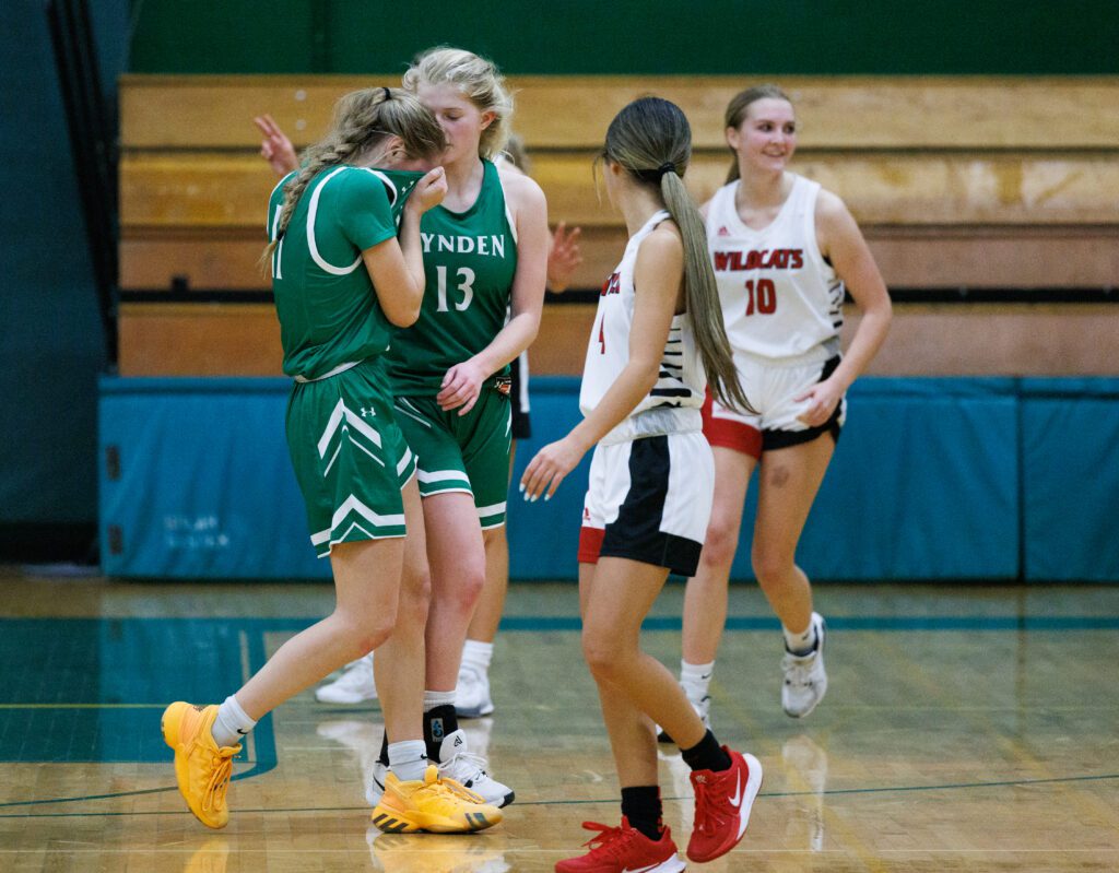 Lynden's Mallary Villars, left, is comforted by teammate Adia Newcomb.