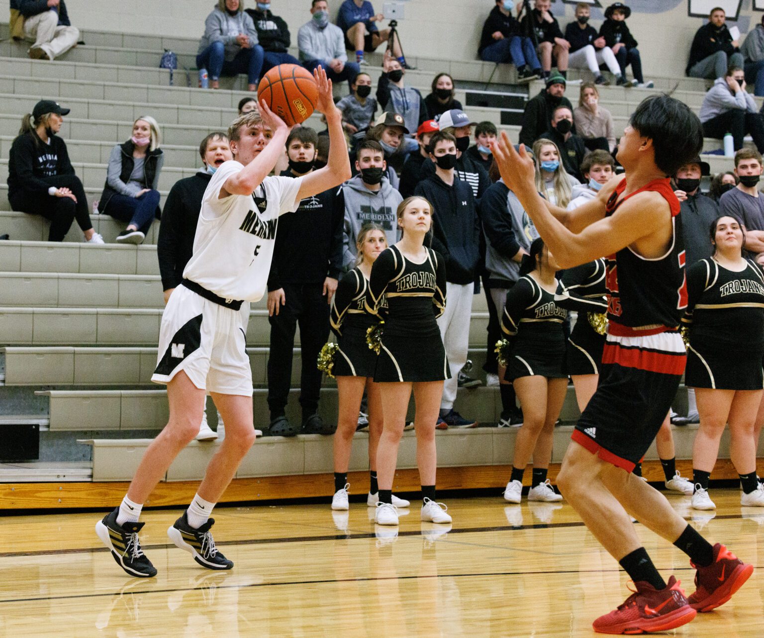 Meridian's Jaeger Fyfe leaps slightly to score.