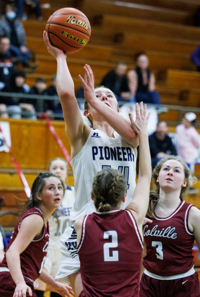 Nooksack Valley’s Devin Coppinger jumps over the defenders.