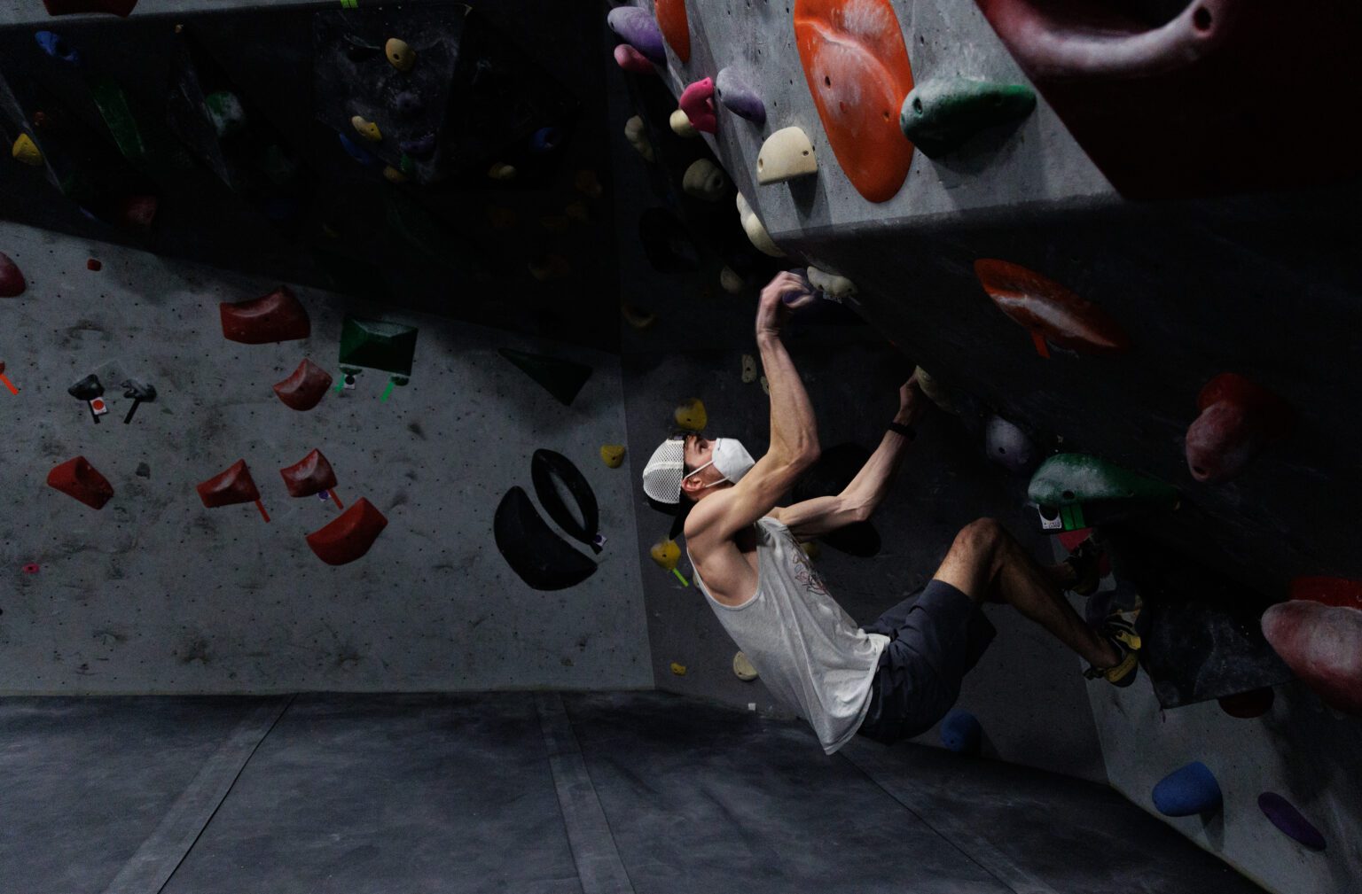 Rainer Luhrs looks for a hold on an overhanging area.