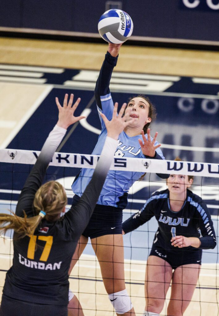 Western Washington University’s Calley Heilborn spikes the ball with an expression.