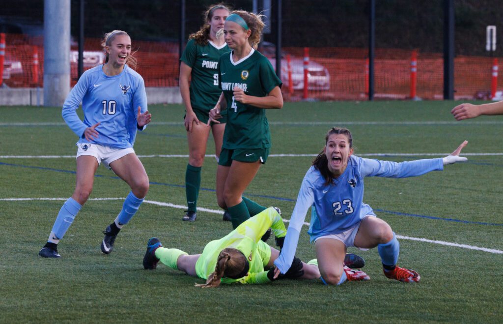 Western Washington University’s Estera Levinte, right, celebrates the goal as the goalkeeper is left on the grass behind her.