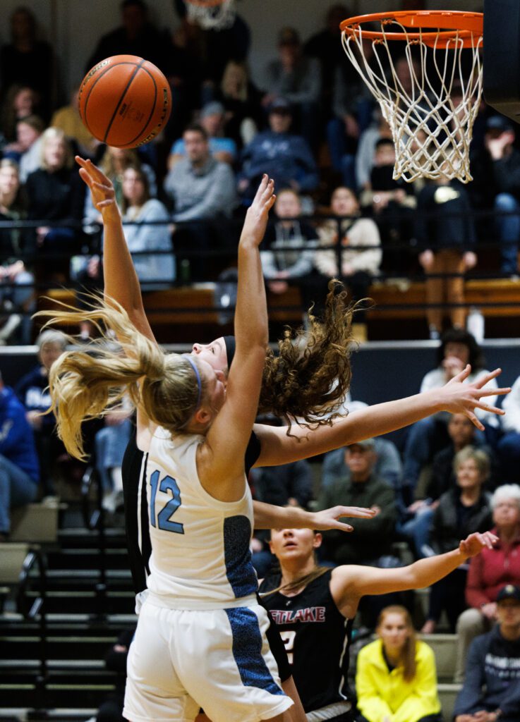 Eastlake’s Ava Schmidt blocks a shot by swatting the ball away Lynden Christian’s Ella Fritts.