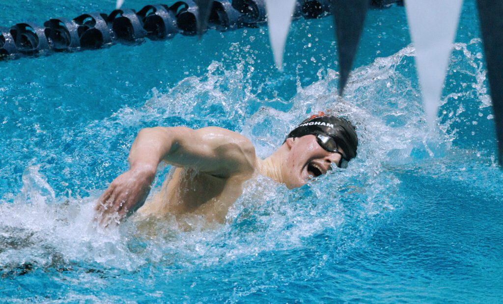 Bellingham's Miles Cratsenberg takes a breath sideways as water splashes all around them.