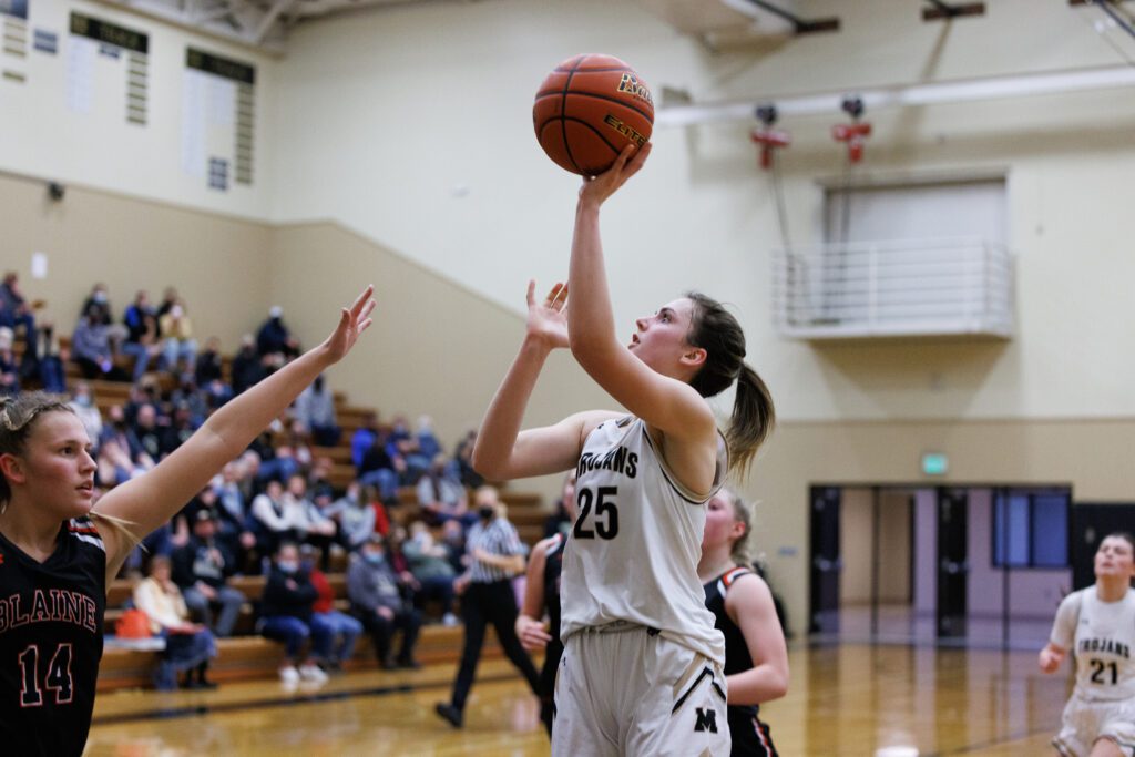 Meridian's Ellie DeWaard looks up to put up a shot.