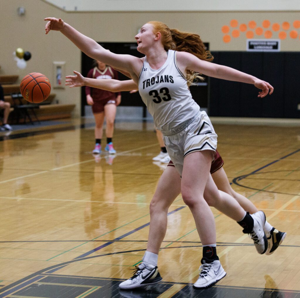 Meridian's Skyleigh James swats away a pass to an opposing player.