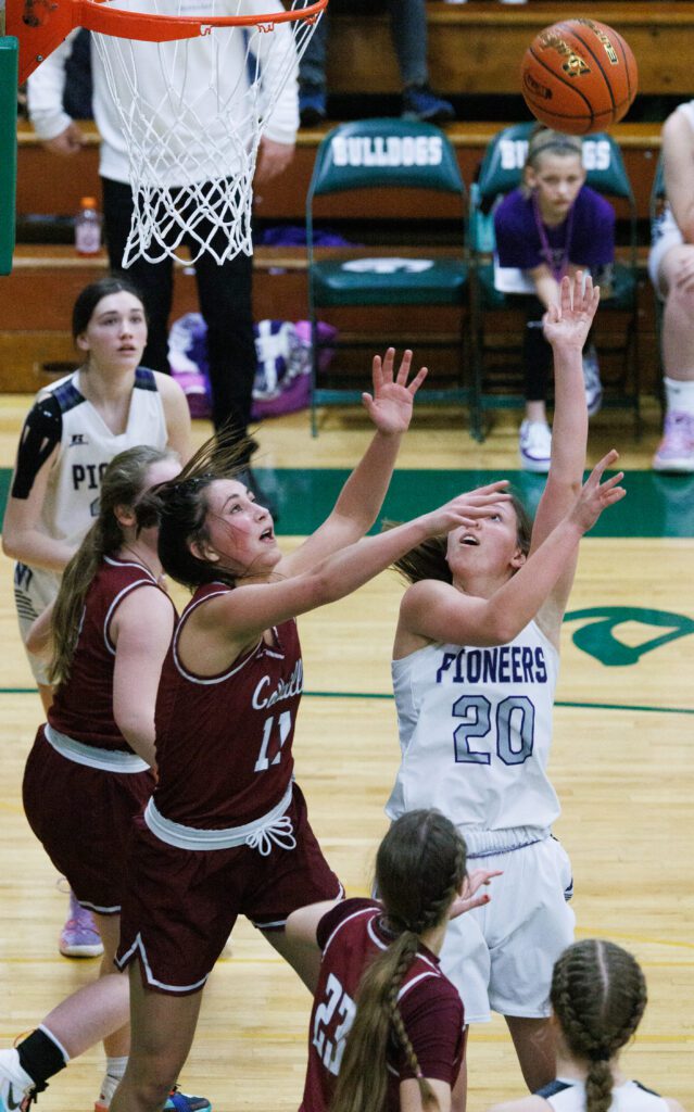 Nooksack Valley’s McKenna Wichers hits a shot over Colville's AshNe'a Anderson.