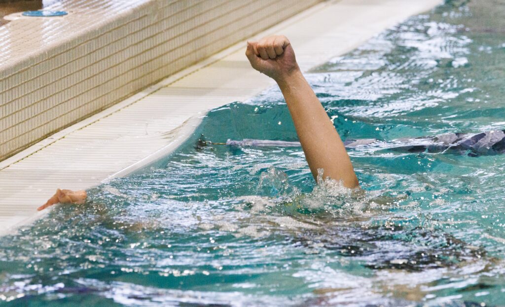 Sehome’s Luna Lee pumps a fist as she dips back into the pool.