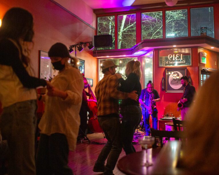 People dance while Nuages performs Gypsy jazz at Uisce Irish Pub.