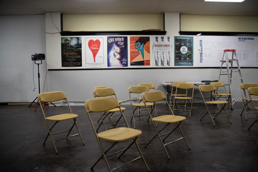 Empty chairs and movie posters fill the Pickford's future three-theater venue.