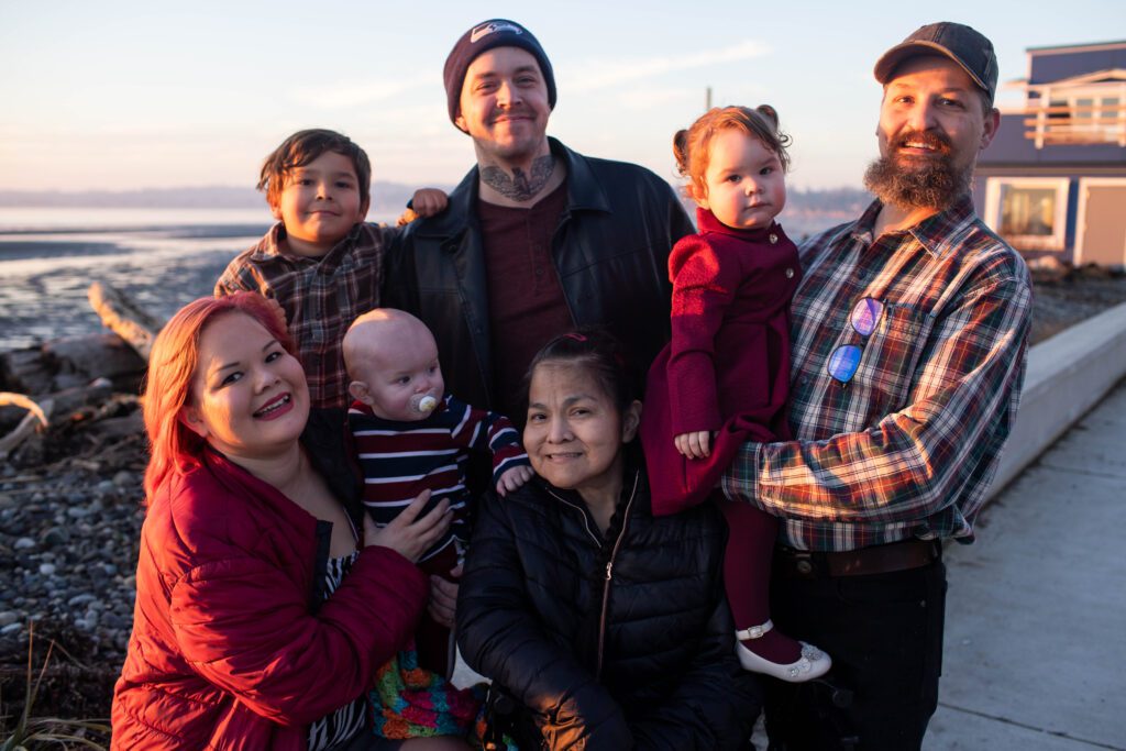 (Front from left) Melanie Carr, Ethan Markum, Ethel Markum, (back from left) Westley Carr, Sven Markum, Amelia Markum and Ken Markum take a group photo as the sun set shines on them.