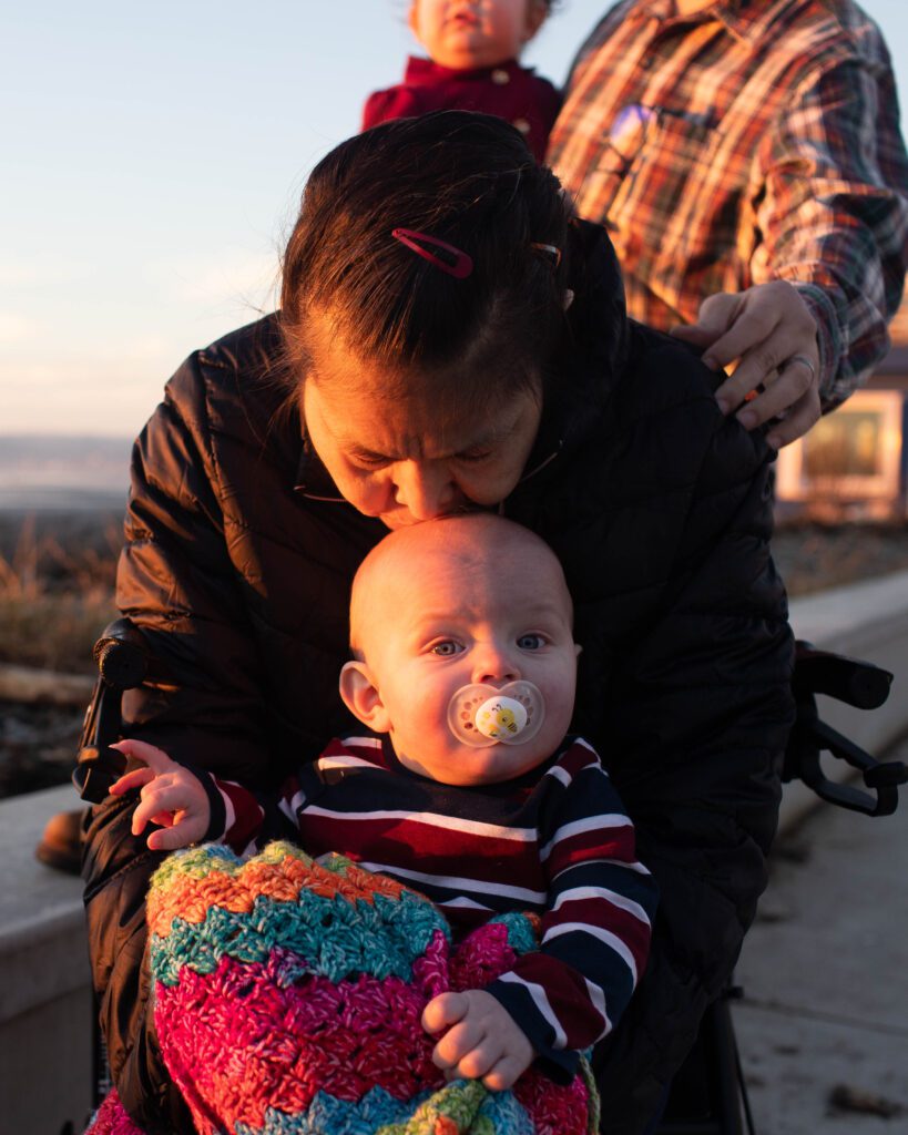 Ethel Markum kisses her grandson Ethan's head.