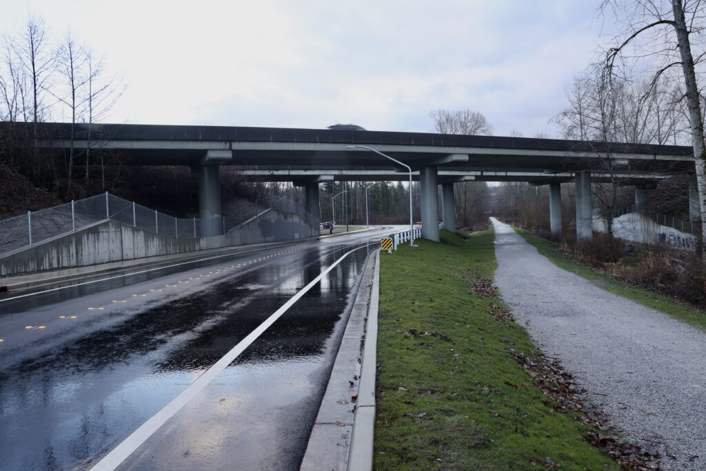 The new road includes a sidewalk, bike lanes and the adjacent Squalicum Creek Trail.