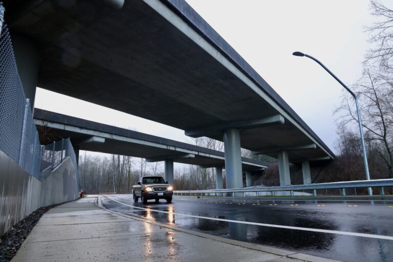 The Birchwood Avenue-Interstate 5 underpass with a car passing underneath.