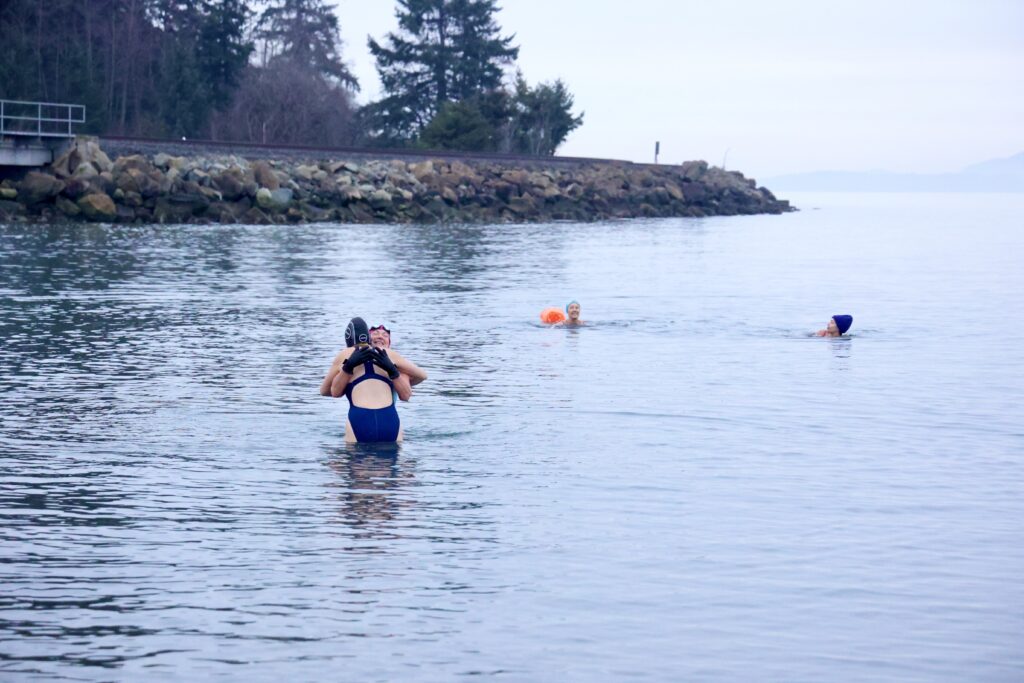 Kelcey Bates hugs Olivia Gleser while in the waters.