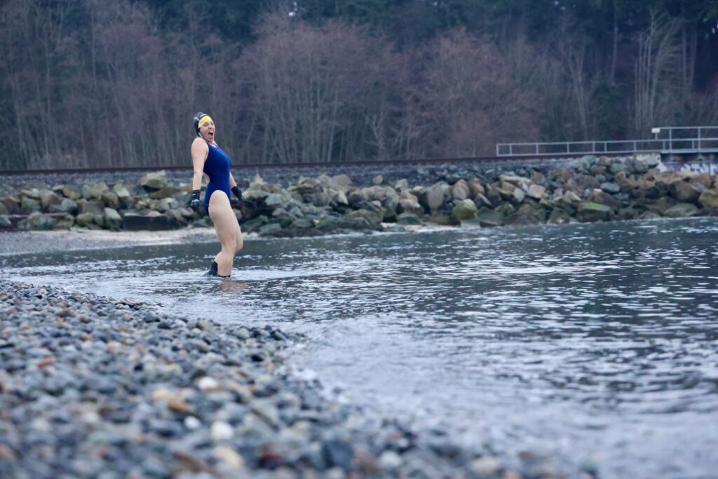 Olivia Gleser reacts as she dips into the cold water.