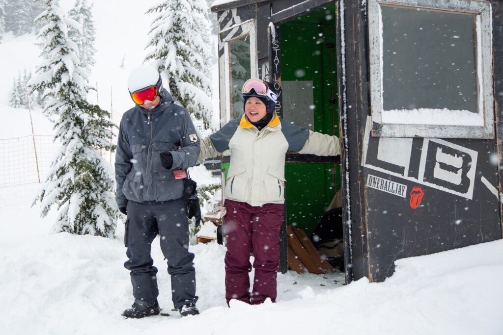 Quezar guides Bernice toward the altar as snow continues to fall around them.