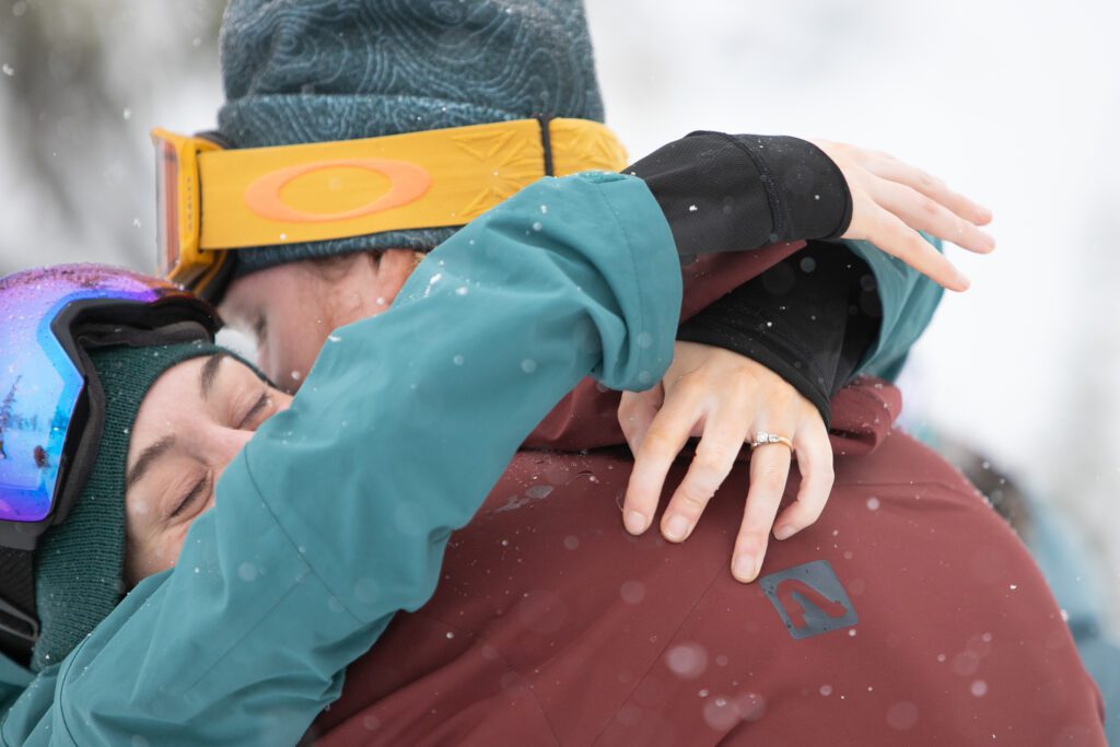 Maeghan and Brian embrace at the end of the ceremony with snow sticking on their clothes.