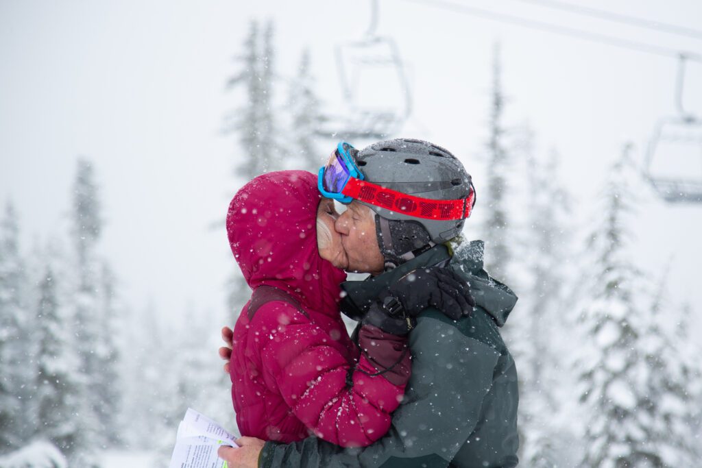 Jack Bunnell and Kristan Warrior-Bunnell kiss after renewing their vows underneath the snow.