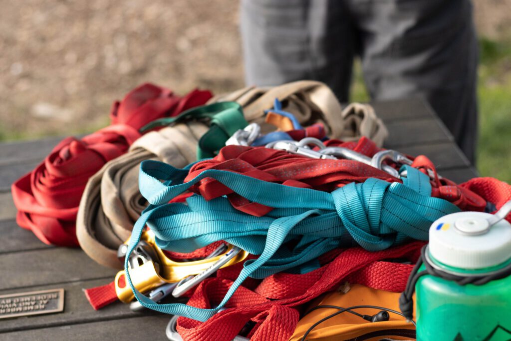 Chandler Johnston lays out his collection of colorful lines and slackline equipment on the picnic table.