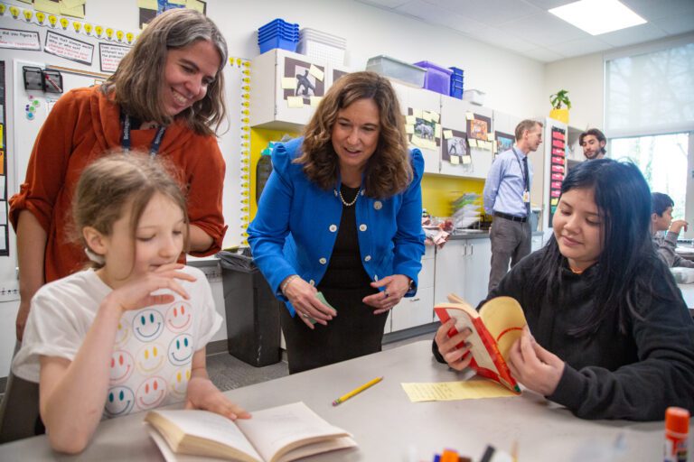 From left, Jade Mullen, fourth-grade teacher Jayme Rios, Deputy Secretary Cindy Marten and Janice Siftsoff-Jackson talk about the book 'Hate the Cat' during a book club meeting.