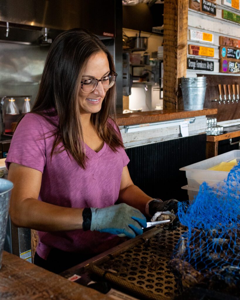 Amanda Baldwin shucks oysters at the Drayton Harbor Oyster Company.