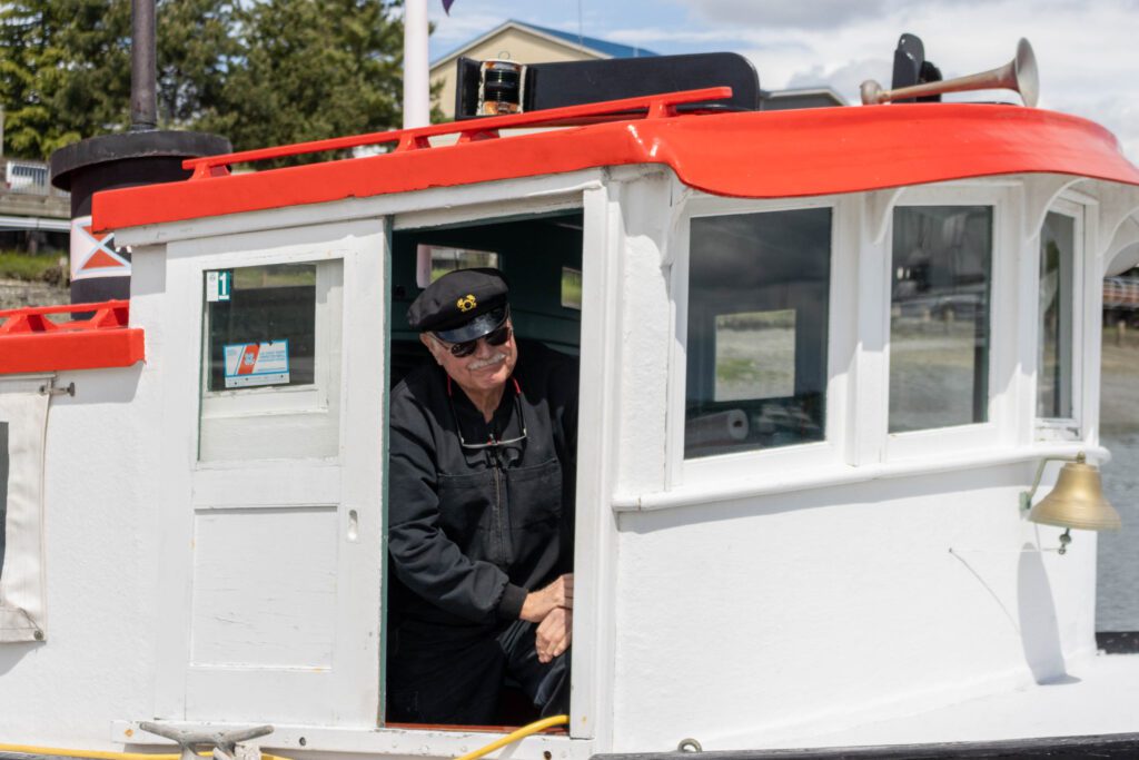 Richard Sturgill, the founding director and manager of the Plover Ferry, stands inside the boat.