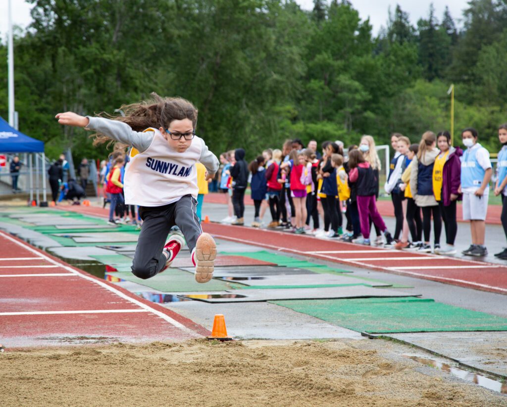 Rowan Rail soars through the air aiming for the sand.