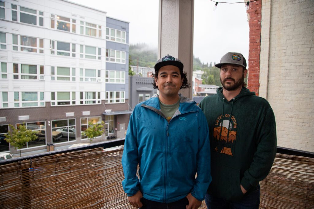 Nick Leader, left and Andrew Moyer stand on Moyers' balcony at The Atrium condominiums.