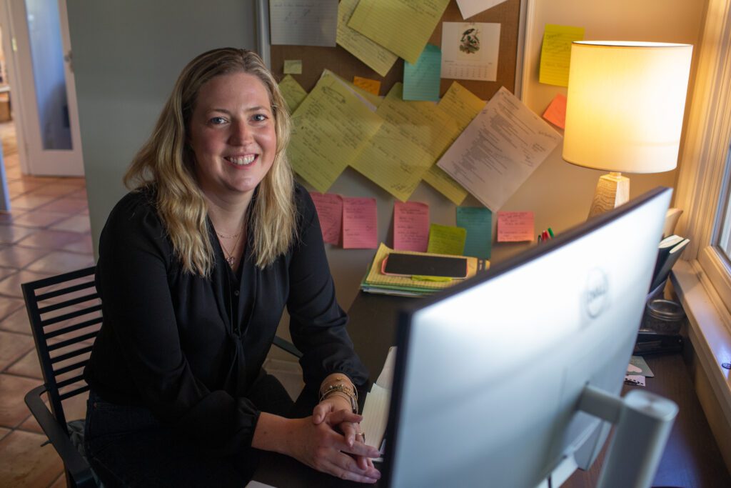 Karli Pickett sits at her home office.