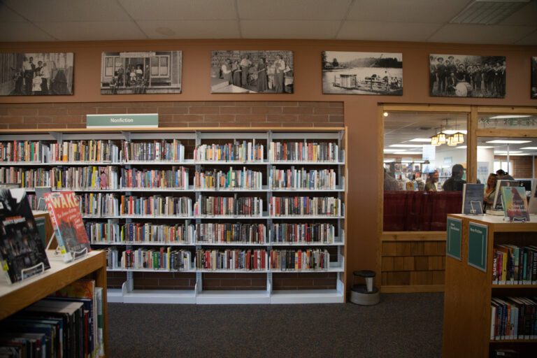 Custom shelves inside the Everson Library filled to the brim with books.