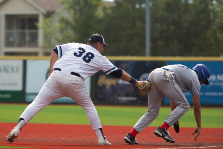 Bellingham's Jace Phelan picks off a Kelowna Falcon runner at first base.