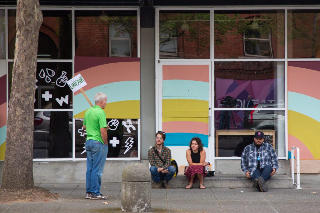 Baker Lanes (left) arrived Wednesday morning to protest "Uncringe Academy" classes at WinkWink.