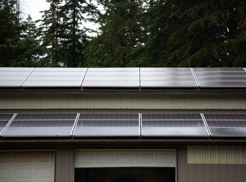 An array of solar panels on the roof of the building.