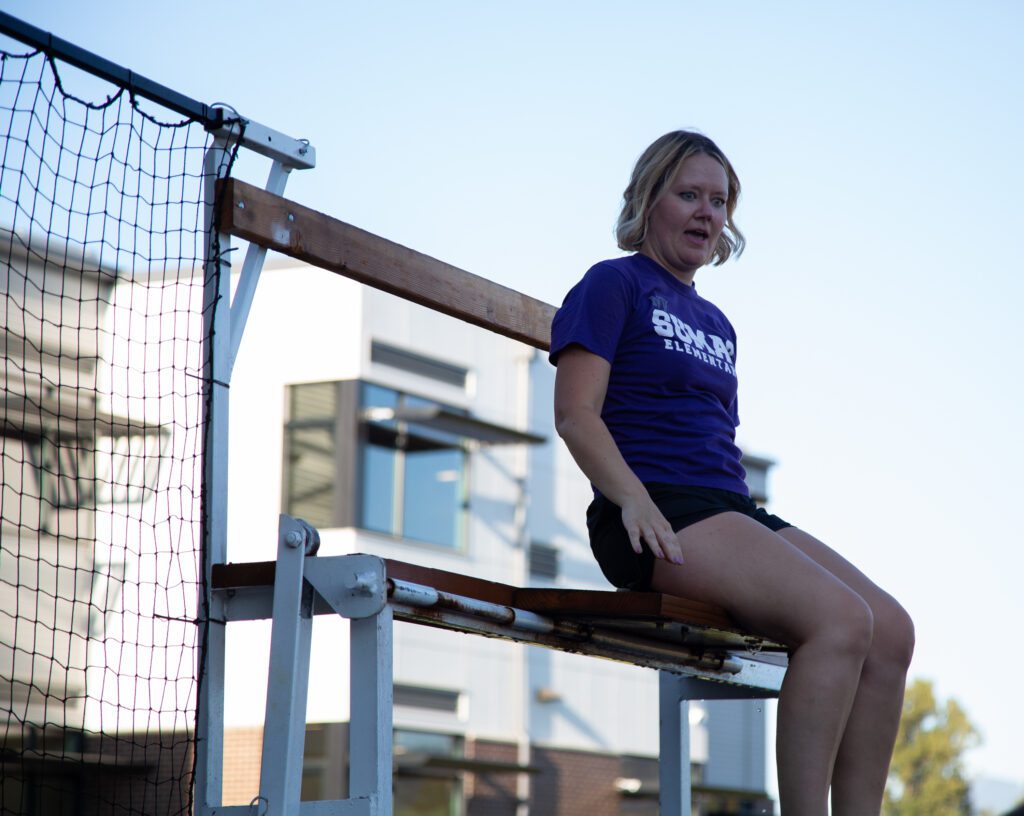 Principal Sarah Condreay watches in terror as students try to dunk her into the water.