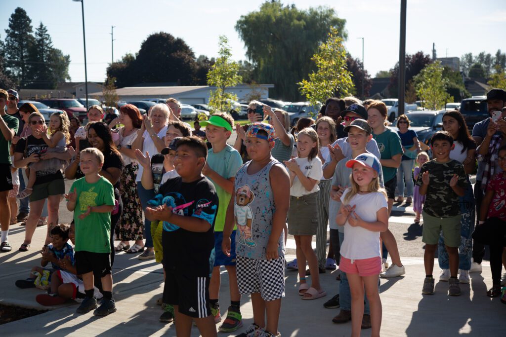 Large groups of students and famillies cheer for the opening of the new Sumas Elementary School building.