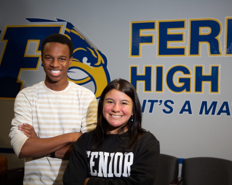 Junior Kwabena Ledbetter, left, and senior Jazzie Gonzales smile side by side.