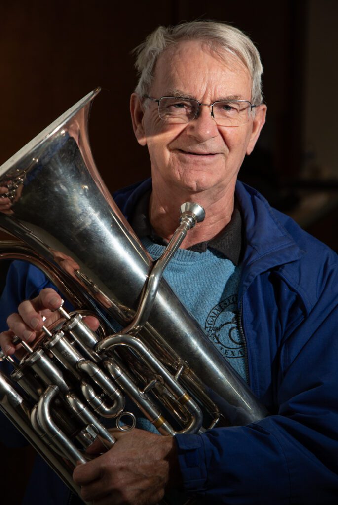 Tom McFarland holds up an euphonium.