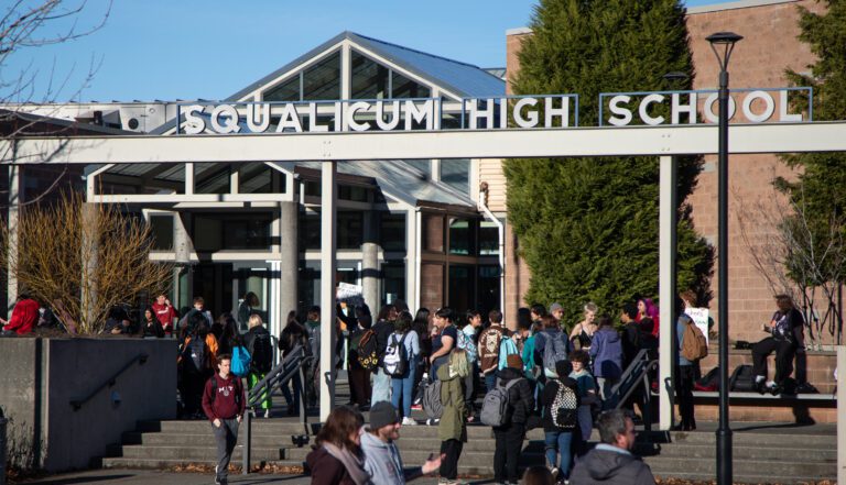 Student protesters stand outside Squalicum High School after crowds of students disperse at the end of their classes.