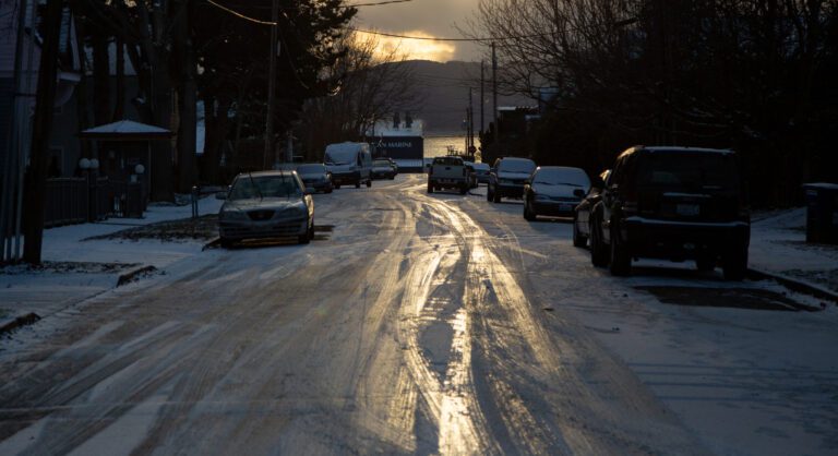 The sunset illuminates an icy H Street.