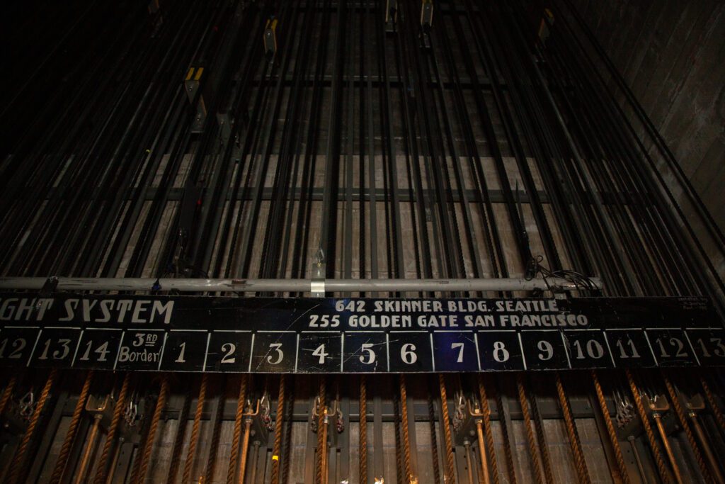 Dozens of numbered lines controlling curtains and backdrops cover the wall backstage of the Mount Baker Theatre.