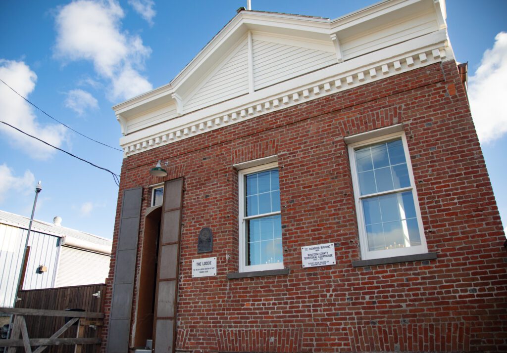 The front entrance of the brick building of the Helen Loggie Museum of Art.