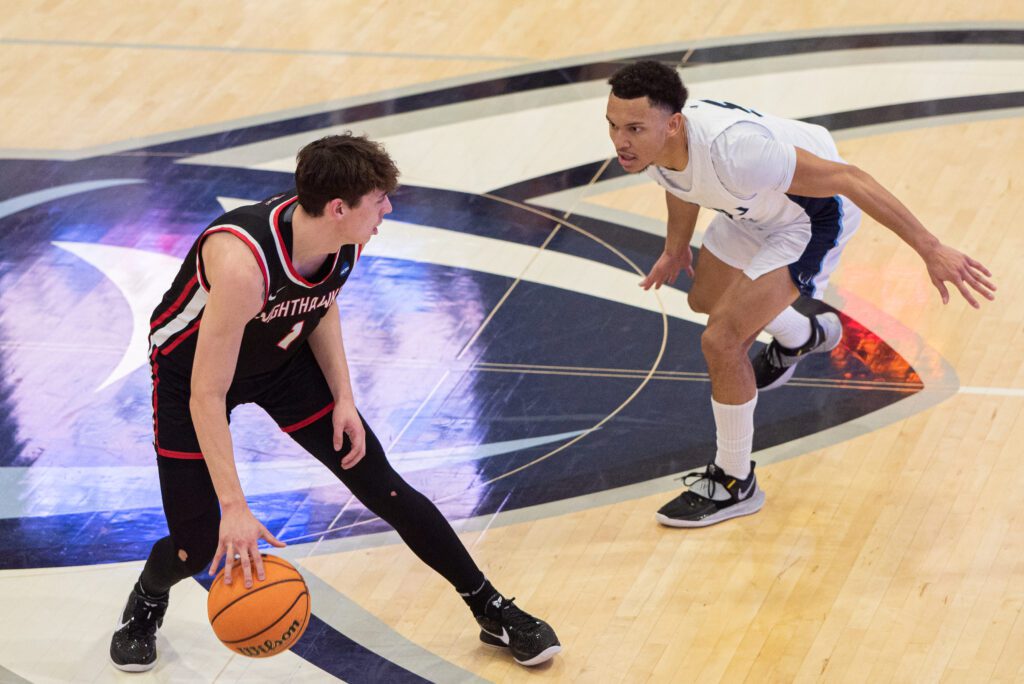 Western junior guard D'Angelo Minnis pressures Northwest Nazarene redshirt senior guard Kobe Terashima as he looks for an opening.