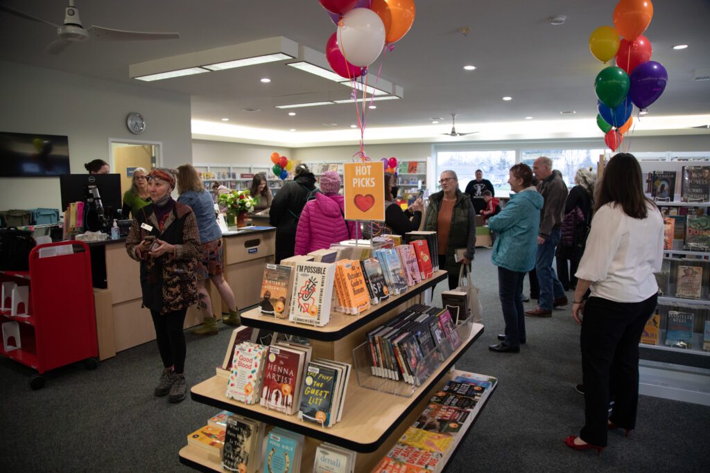 Dozens of people queuing with their selection books.